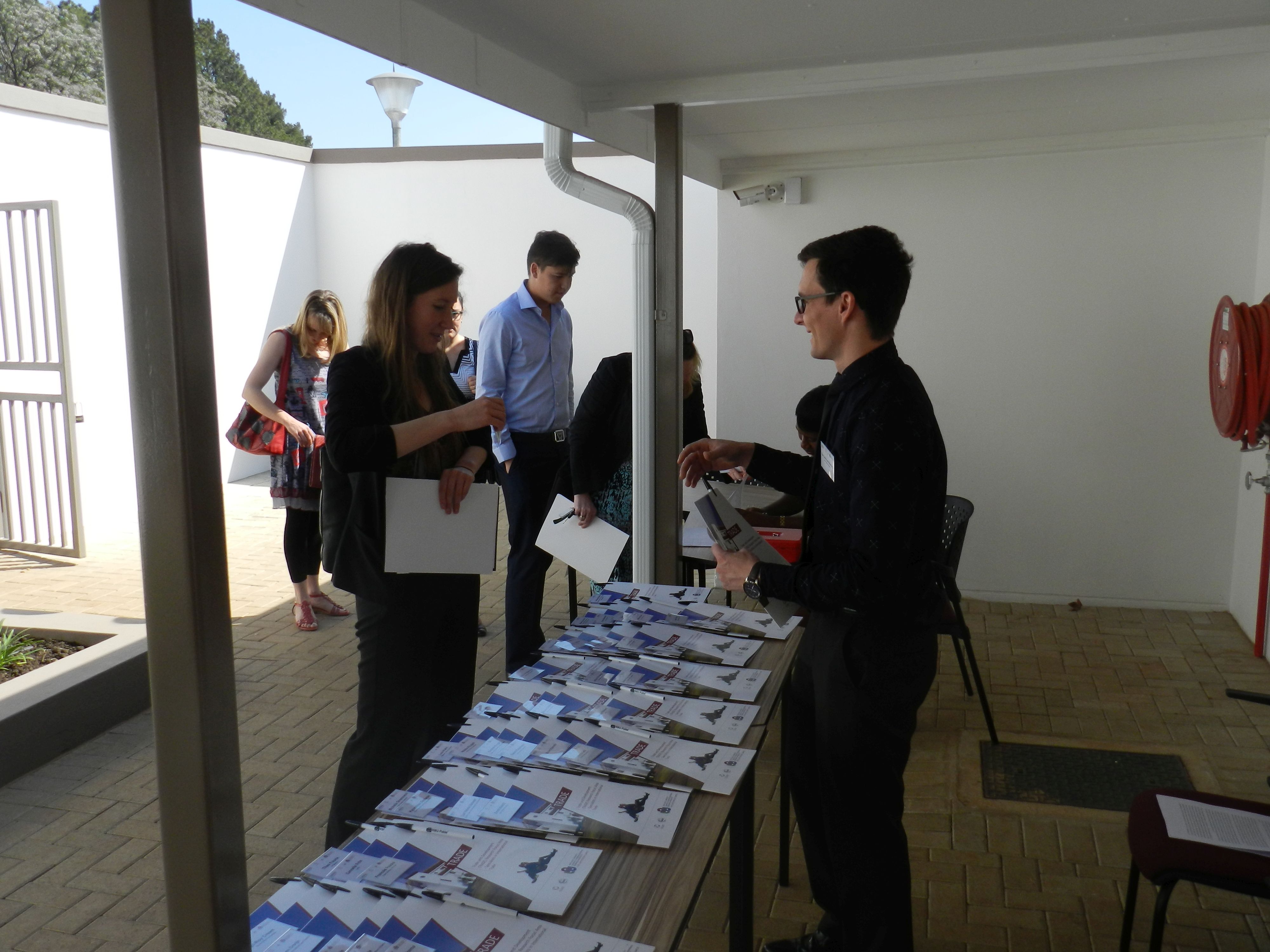 Guests begin to arrive and register/receive their information packages